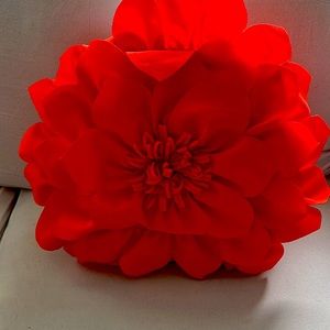 Vibrant reddish orange accent pillows for patio